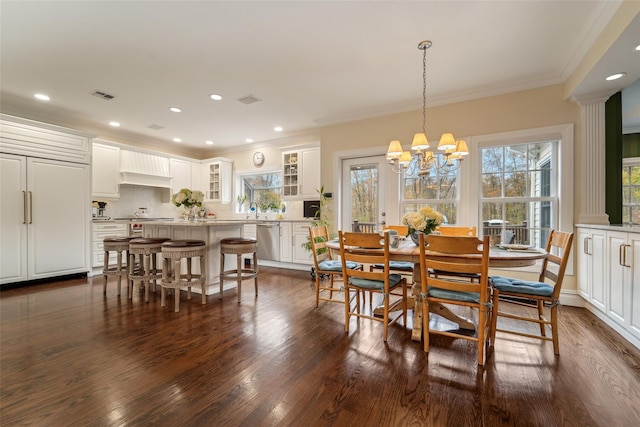 dining space with dark wood-type flooring, recessed lighting, visible vents, and crown molding