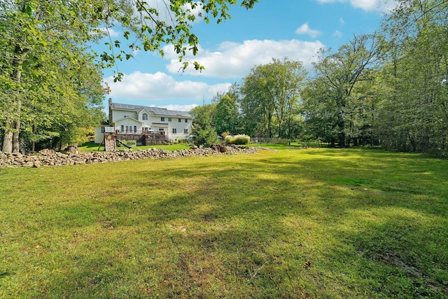 view of yard featuring a deck