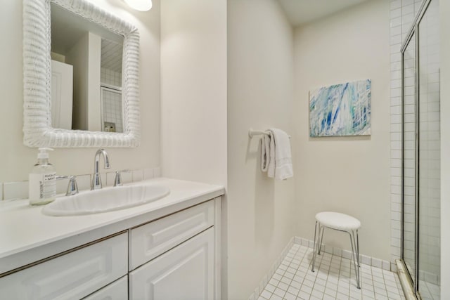 bathroom with a shower with door and vanity