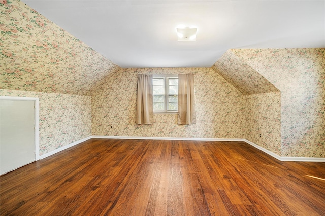 bonus room featuring hardwood / wood-style flooring and lofted ceiling