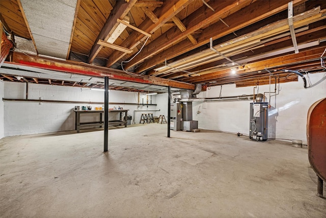 basement with heating unit and water heater