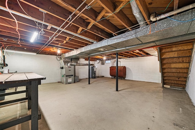 basement with heating unit and water heater