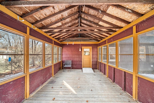 unfurnished sunroom with lofted ceiling and wood ceiling