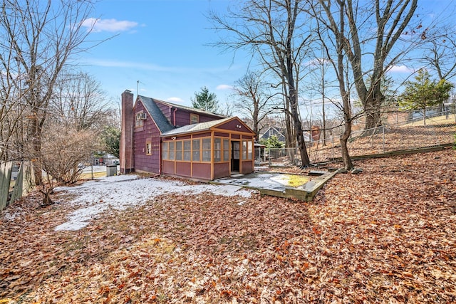 view of yard featuring a sunroom