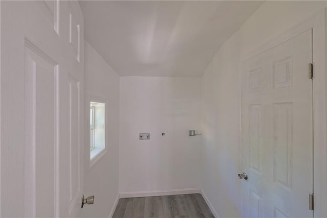 clothes washing area featuring wood-type flooring