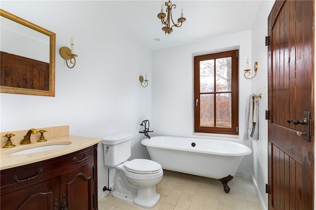 bathroom with a bathing tub, vanity, and toilet