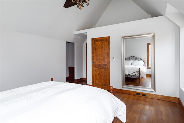 bedroom featuring dark wood-type flooring, ceiling fan, lofted ceiling, and a closet