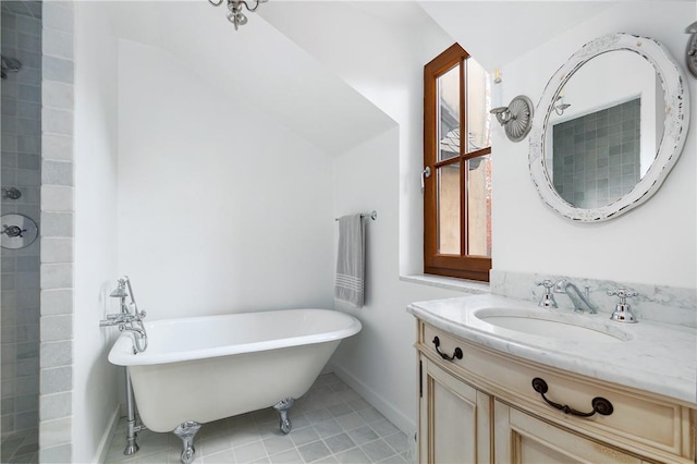 bathroom with vanity, a tub to relax in, and tile patterned floors