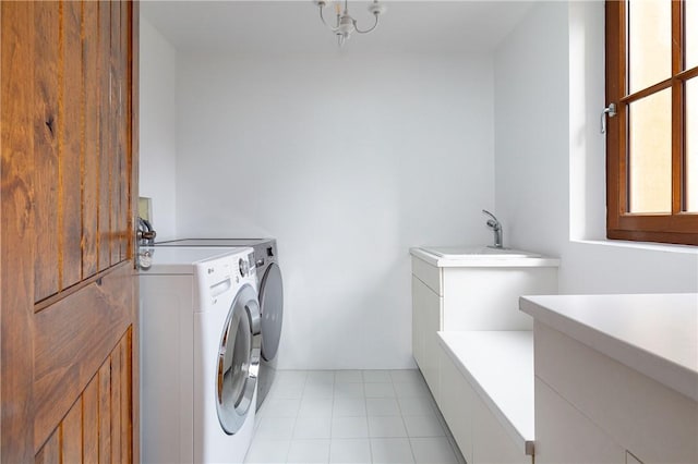 clothes washing area with cabinets, independent washer and dryer, sink, and light tile patterned floors