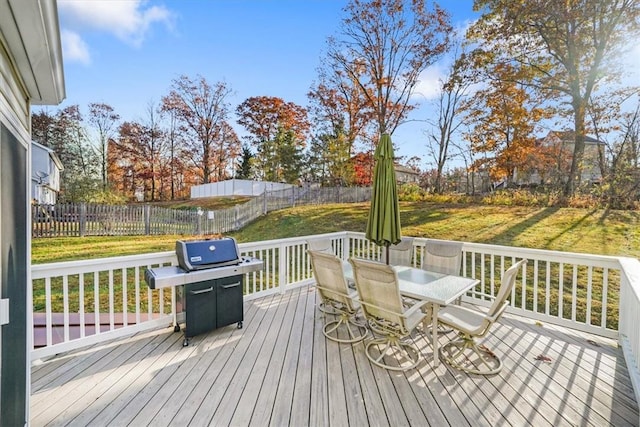 deck featuring a yard and area for grilling