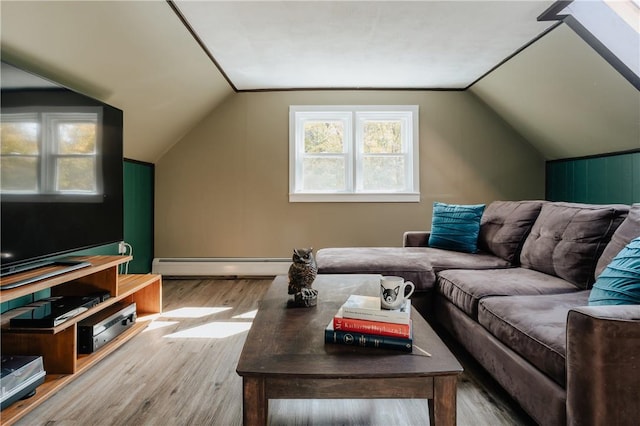 living room with wood-type flooring, lofted ceiling, and baseboard heating