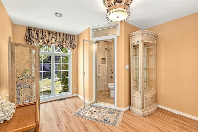 doorway to outside with wood-type flooring