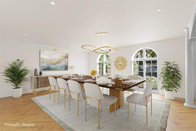 dining space featuring light parquet flooring