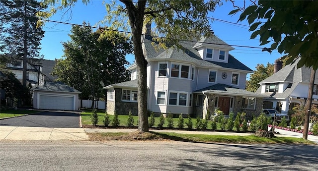 view of front of house with an outbuilding and a garage