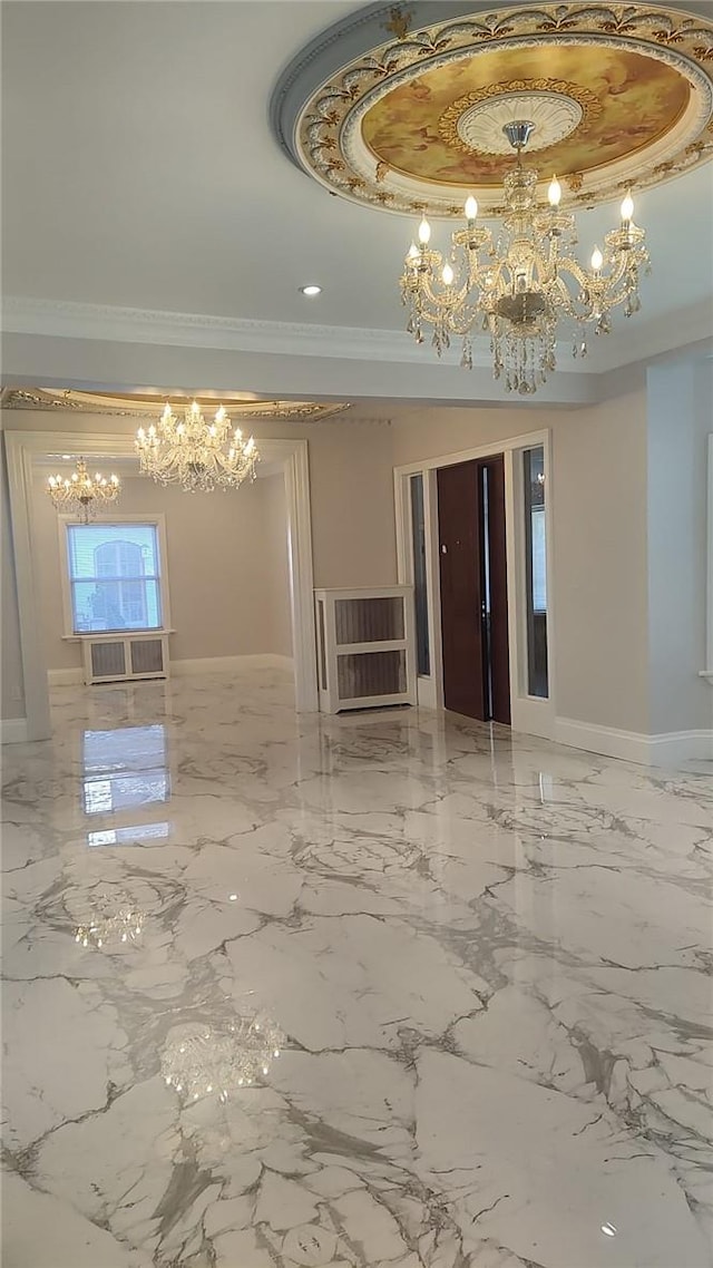 spare room featuring crown molding and an inviting chandelier