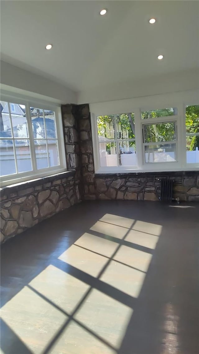 unfurnished sunroom featuring plenty of natural light