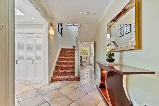 interior space featuring tile patterned flooring and crown molding