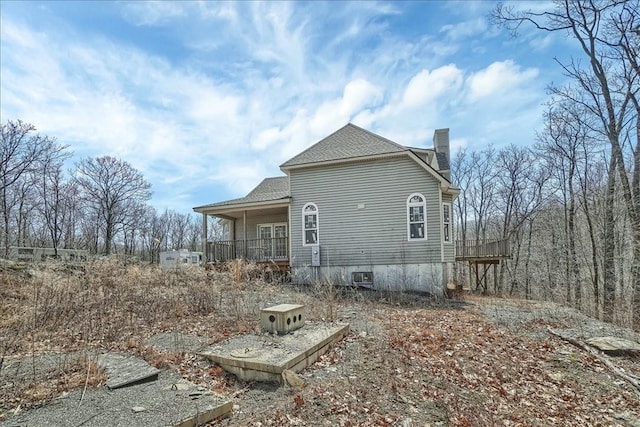 rear view of house with a porch