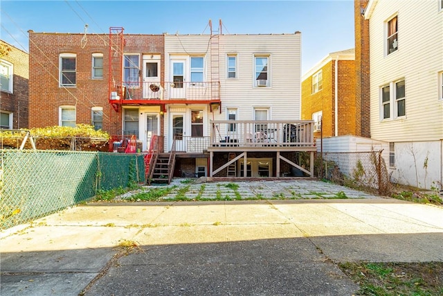 back of property with a wooden deck