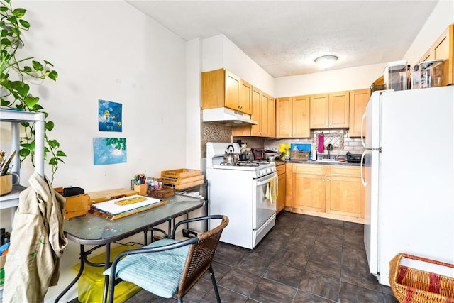 kitchen with light brown cabinets, sink, white appliances, and backsplash