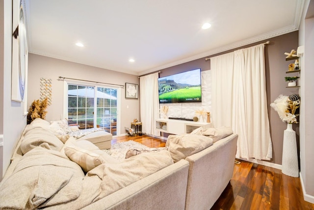 living room with dark hardwood / wood-style flooring and crown molding