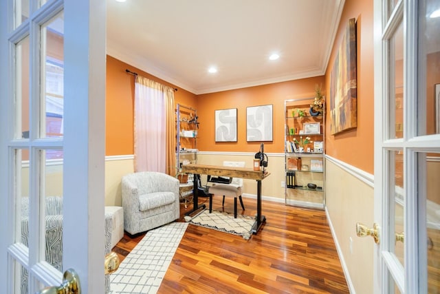 office with crown molding and hardwood / wood-style floors