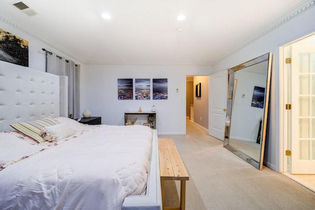 carpeted bedroom featuring ornamental molding and a closet