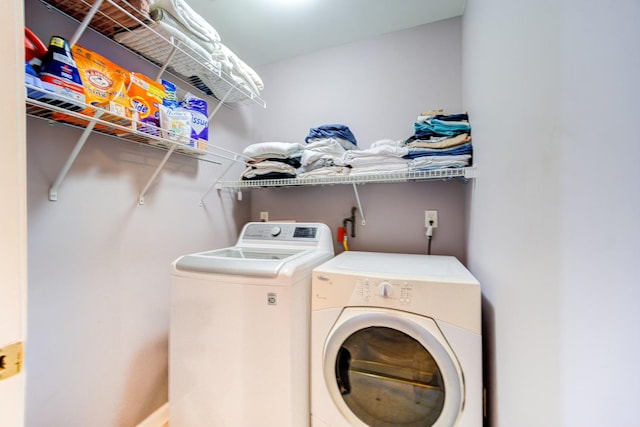 laundry area with independent washer and dryer