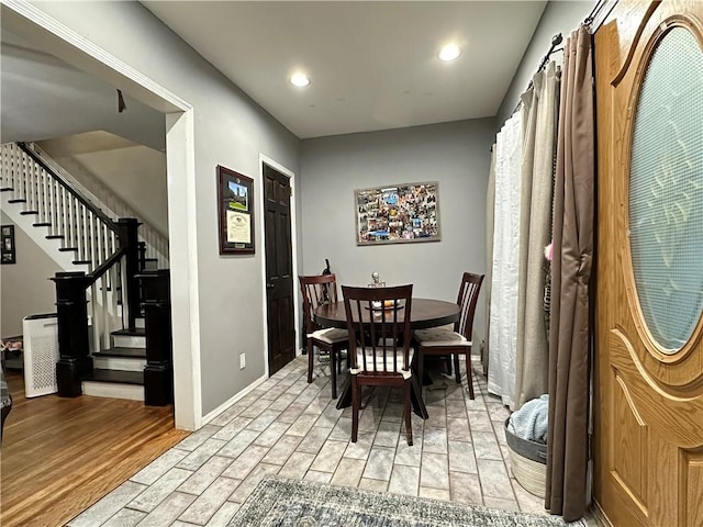 dining space with light hardwood / wood-style flooring