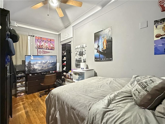 bedroom featuring ceiling fan and hardwood / wood-style flooring