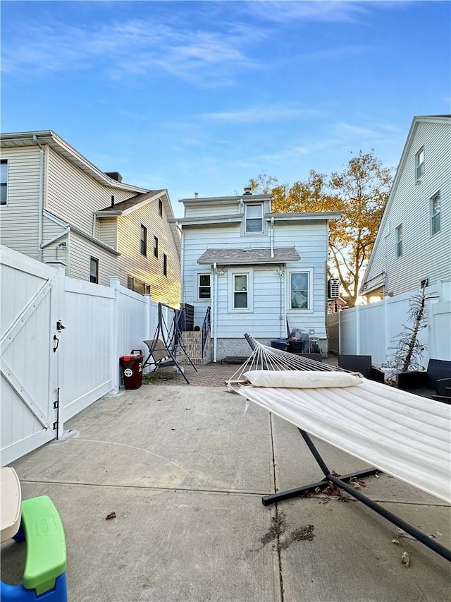 back of property featuring a patio