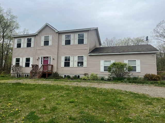 rear view of property with a yard