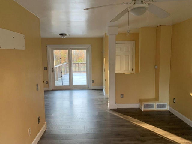 spare room featuring ceiling fan and dark hardwood / wood-style flooring