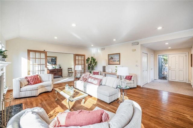 living room featuring light wood-type flooring and lofted ceiling