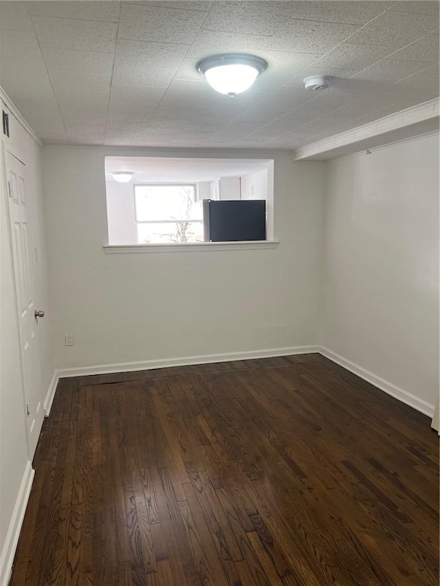 spare room featuring crown molding