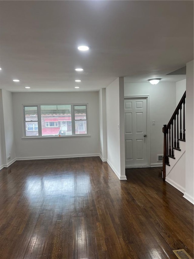 spare room featuring wooden walls