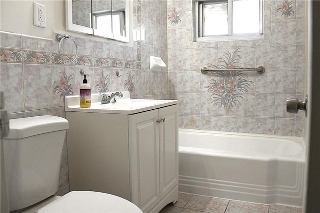 full bathroom featuring vanity, toilet, and tile walls