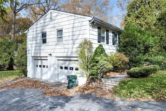 view of property exterior featuring a garage