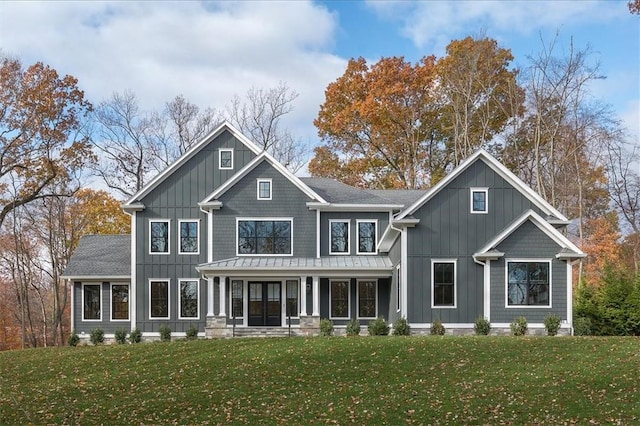 view of front facade with a front yard and a porch