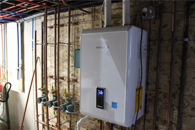 utility room with tankless water heater