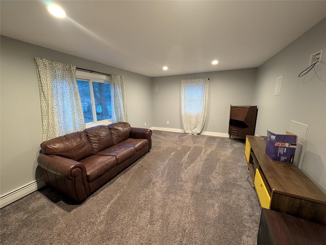 living room with dark colored carpet and a baseboard heating unit