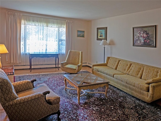 living room featuring wood-type flooring and a baseboard heating unit