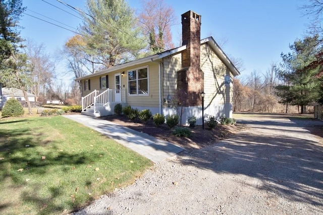 ranch-style home with a front yard