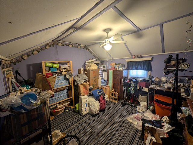 interior space with ceiling fan and lofted ceiling