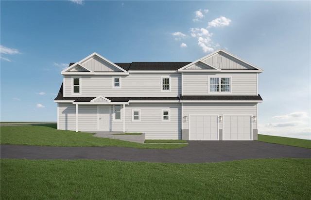 view of front facade with a garage and a front lawn