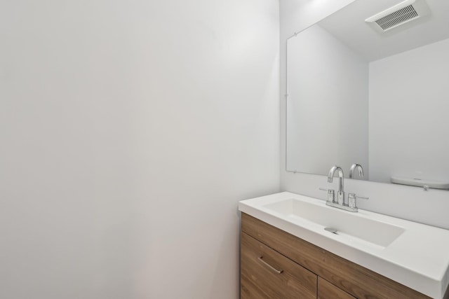 bathroom with vanity and visible vents