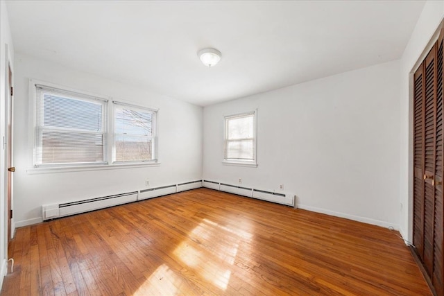 unfurnished bedroom with wood-type flooring and a closet