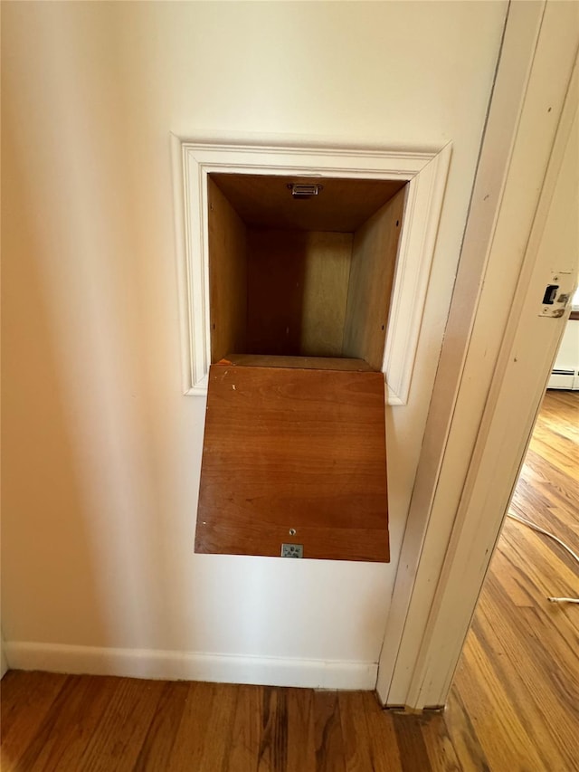 room details featuring hardwood / wood-style flooring and baseboard heating