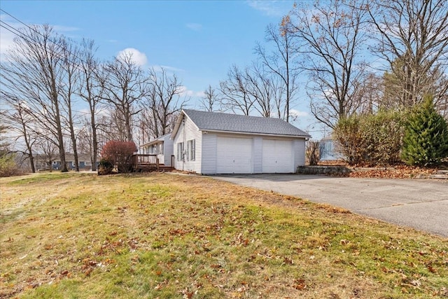 garage featuring a lawn