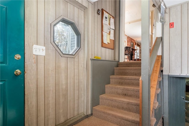 staircase with wooden walls